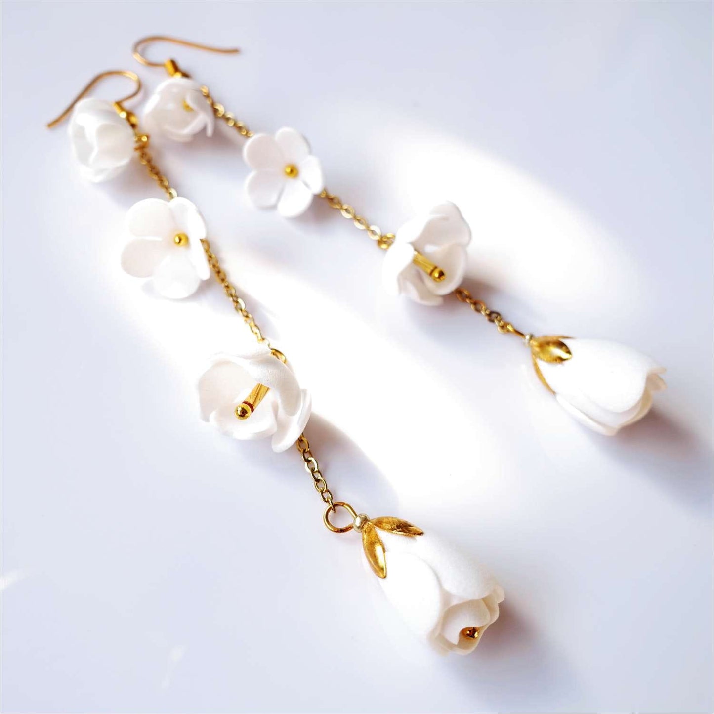 White Lilly DK856 white flower earrings on a gold chain