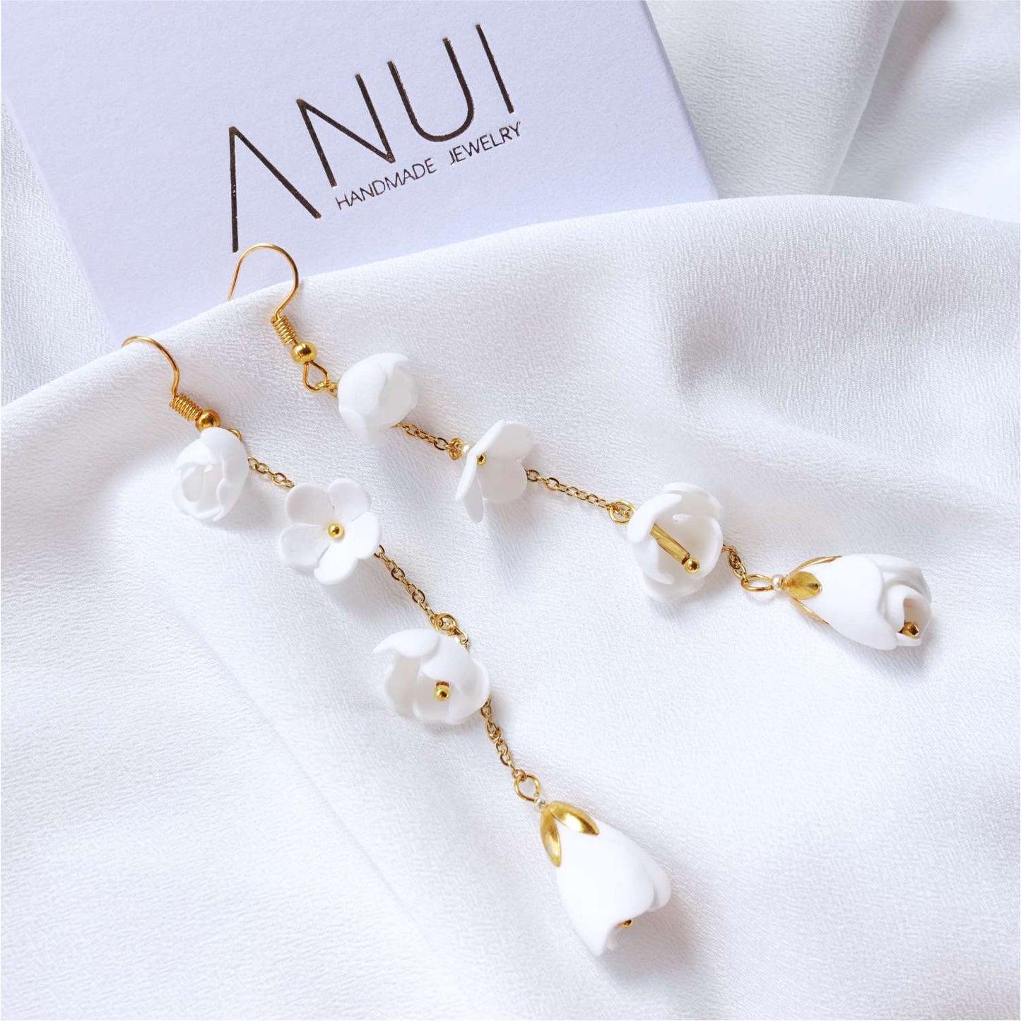 White Lilly DK856 white flower earrings on a gold chain